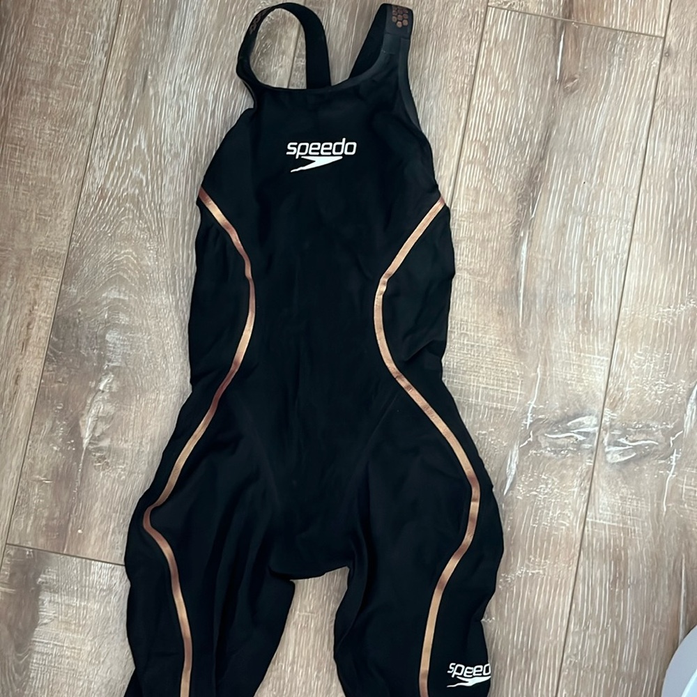 Speedo LZR tech suit. 6 races total. So much life left. Closed back.